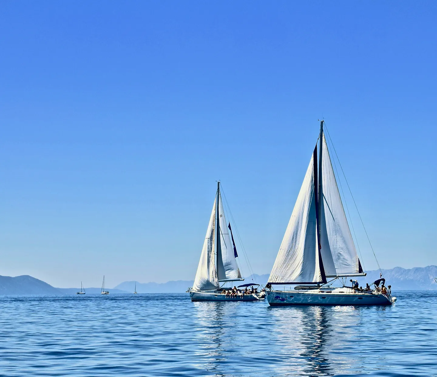 Sailing yacht under way during a boat show